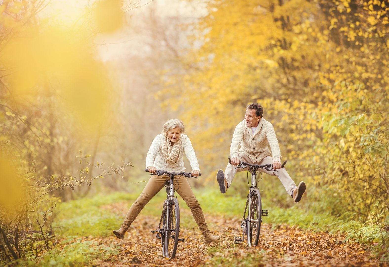 Couple Riding Bikes in Fall